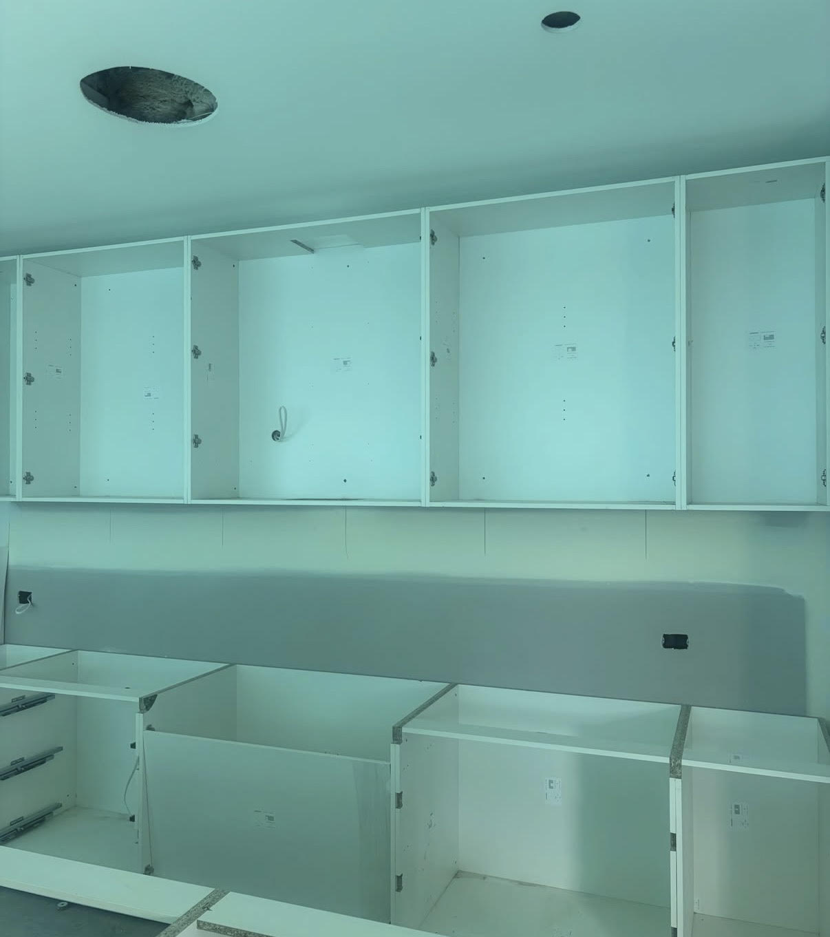 Kitchen cabinetry installation at the Chisholm project